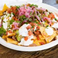 Regular Nachos · Any meat, tortilla chips, beans, melted jack cheese and salsa.