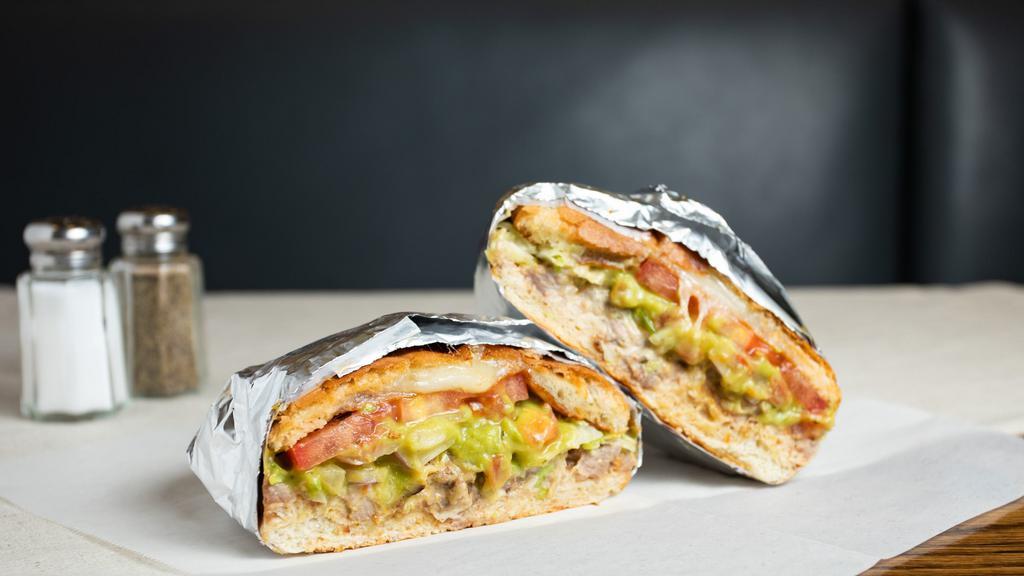 Torta · Tasted Mexican bread with any meat, refried beans, cheese, sour cream, tomato, lettuce and guacamole.