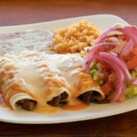 Enchiladas · Corn tortillas, any meat, rice, beans, sour cream, guacamole and salad.