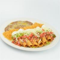 Flautas · Six rolled fried corn tortillas with chicken, sour cream, guacamole and salad.