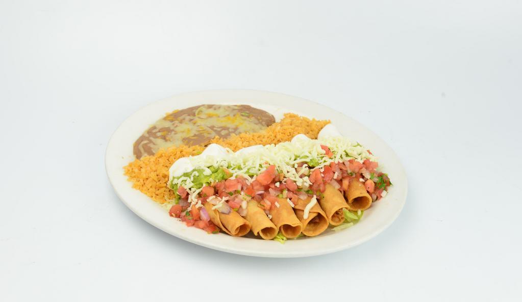 Flautas · Six rolled fried corn tortillas with chicken, sour cream, guacamole and salad.