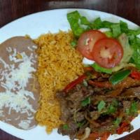Bistec Ranchero · Mexican style grilled beef steak, beans, rice, sour cream, guacamole, salad and tortillas.