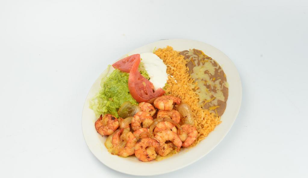 Camarones A La Plancha (Grilled Shrimp) · Prawns with onion, mild peppers, bacon, rice, beans, sour cream, guacamole, salad and tortillas.