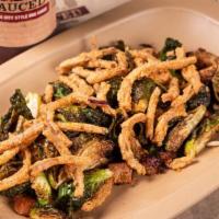 Glazed Brussel Sprouts · flash fried brussels and braised . pork belly tossed with honey . balsamic glaze - garnished...