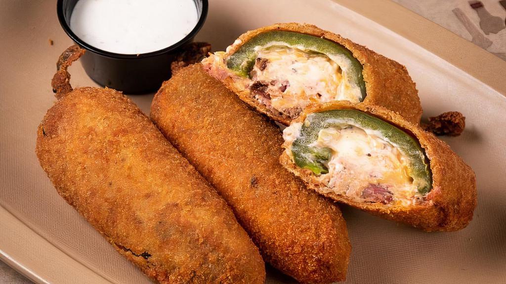 Hand Grenades · house made jalapeno poppers with pulled pork, sharp cheddar, cream cheese and . tin roof - served with ranch