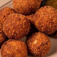Cheezy Cornbread Fritters · AKA HUSHPUPPIES. chopped applewood bacon, sharp . cheddar and diced jalapeno – served . with...