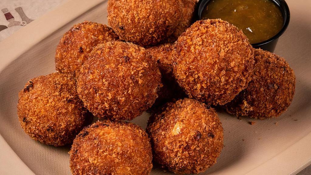 Cheezy Cornbread Fritters · AKA HUSHPUPPIES. chopped applewood bacon, sharp . cheddar and diced jalapeno – served . with house peach chutney and. brown sugar cinnamon butter