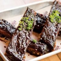 Sticky Ribs · smoked and deep fried spare ribs tossed . in a house made asian sticky sauce with . toasted ...