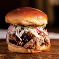 Carolina Pulled Pork Sandwich · served southern style,  no frills on a soft . brioche bun, sauce it up to your liking