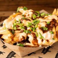 Honky Tonk Fries · house rub, queso, . baked beans, green onion, . chipotle sour cream