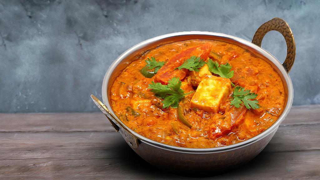 Shahi Paneer (SP) · Homemade cheese cubes sautéed with fresh ginger, garlic, onions and tomatoes in a cream sauce garnished with nuts.