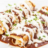 Enchilada Deluxe · Mouthwatering House special Enchilada prepared to perfection and served with guacamole and s...