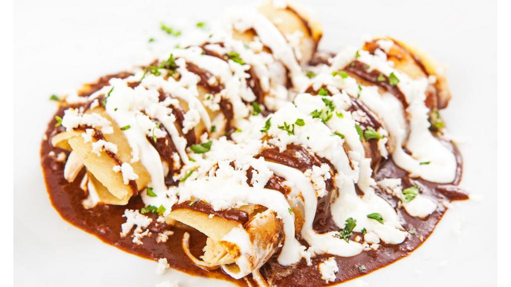 Enchilada Deluxe · Mouthwatering House special Enchilada prepared to perfection and served with guacamole and sour cream.