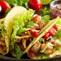 Chile Verde (Pork Shoulder) Taco · Mexican-style Taco prepared with Pork Shoulders cooked in green chili sauce, and topped with...