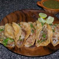 Tripas (Beef Tripes) Taco · Mexican-style Taco prepared with Grilled Beef Tripes, and topped with cilantro, diced onions...