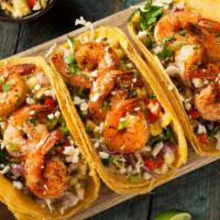 Camaron (Shrimp) Taco · Mexican-style Taco prepared with Shrimp, and topped with cilantro, diced onions, and hot sau...