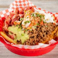 Carne Asada Fries · Perfectly golden-crisp fries topped with ground beef, pico de gallo, sour cream, and guacamo...