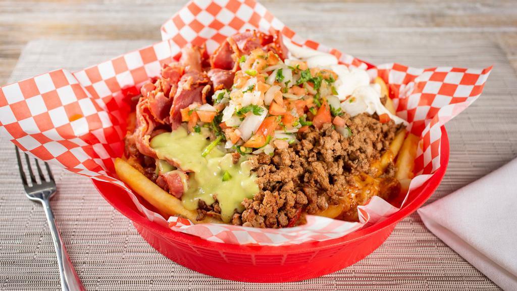 Carne Asada Fries · Perfectly golden-crisp fries topped with ground beef, pico de gallo, sour cream, and guacamole.