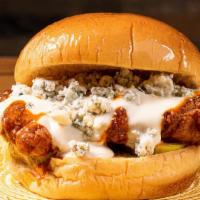 Buff Chick Sandwich · buffalo sauce, blue cheese queso, house pickles