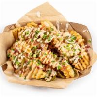 Nacho Fries · queso, bacon, chipotle ranch, pickled jalapeno, green onion