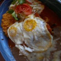 15. Enchiladas Montadas · Choice of chicken, ground beef or cheese topped with two eggs over easy, red sauce and cheese.