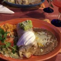 6. Grilled Fish Burrito · Grilled tilapia burrito stuffed with beans, rice, lettuce, pico de gallo and topped with gua...