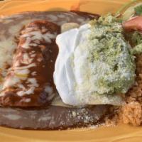 Plato De Tres Colores · Combination of chicken, ground beef and cheese enchiladas topped with red sauce sour cream, ...