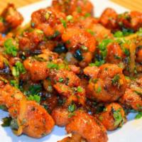 Gobi Manchurian · Indo-chinese appetizer made with cauliflower, bell-pepper, capsicum, hot garlic sauce, vineg...
