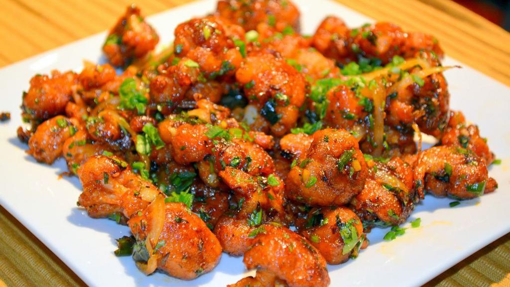 Gobi Manchurian · Indo-chinese appetizer made with cauliflower, bell-pepper, capsicum, hot garlic sauce, vinegar, ginger & garlic.