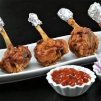 Chicken Lollipop · Tasty chicken appetizer, deep fried and served with hot garlic sauce.