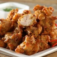 Fish Pakoras · Fish pakora is deep fried in Indian spices and gram flour batter and served with tamarin and...