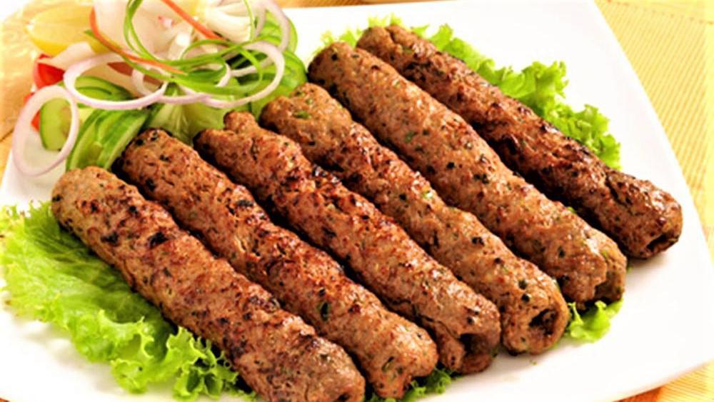 Chicken Sheekh Kabab · Chicken Sheekh Kabab is an Indian appetizer made with ground minced meat and a handful of spices cooked in oven clay and served with a side of green chutney.