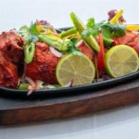 Full Tandoori Chicken · Four pieces of Tandoori Chicken marinated in yogurt and Indian spices then roasted in a hot ...
