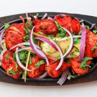 Chicken Tikka Kabab · Chicken breast marinated in yogurt and Indian spices then roasted in a hot tandoor oven clay.