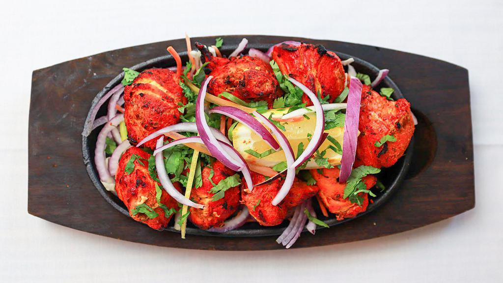 Chicken Tikka Kabab · Chicken breast marinated in yogurt and Indian spices then roasted in a hot tandoor oven clay.
