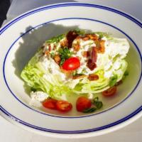 Loaded Wedge Salad · iceberg lettuce, radish, cherry tomato, bleu cheese, applewood bacon, scallions, & blue chee...