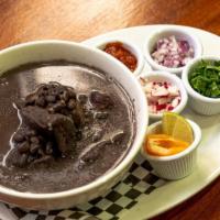 FRIJOL CON PUERCO (PORK BLACK BEAN SOUP) · Black bean pork soup, tomato salsa, Radish, cilantro, diced onions, served with handmade tor...