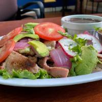 POC-CHUC (MAYAN CLASSIC) · Gilled pork marinated in beer and sour orange juice, served with refried black beans, cabbag...