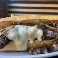 PHILLY CHEESESTEAK · Steak, jack cheese, onions, bell peppers, mushrooms and special sauce.