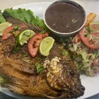 PESCADO FRITO · whole fried fish, served with rice and black refried beans and handmade tortillas
