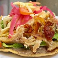 PANUCHOS · Handmade masa tortilla filled with refried black beans, lightly fried. Topped with lettuce, ...