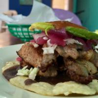 POC- CHUC TACO  · Pork marinated in sour orange juice and Mexican beer, served with refried black beans, cabba...