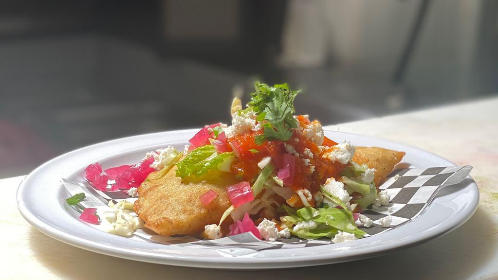 MIXED EMPANADA  · Empanada mixed with ground pork and cheese, topped with cabbage, pickled red onions, tomato salsa and queso fresco