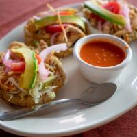 Salbutes · Fried corn tortilla, served with lettuce, marinated cabbage, tomato, marinated onion, and cu...