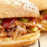 Spicy Slow Cooked Pork Torta · A delicious sandwich made with Mexican bread and filled with marinated spicy Slow cooked por...
