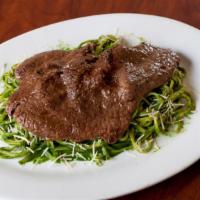 Bistec · A delightful Fried Beef steak served with potatoes, tomatoes, onion, and black pepper. Serve...