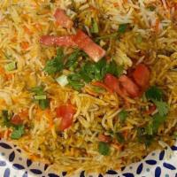 Vegetable Biryani · Saffron flavored basmati rice with vegetables and nuts.