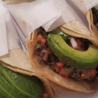 Taco Plate · Three regular tacos with onions and cilantro, (choice of meat) rice and beans.