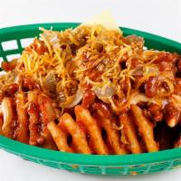Chili Cheese Fries · Cheddar beer fries topped with chili, fried onions and shredded cheddar.