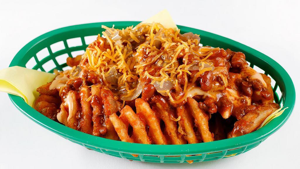 Chili Cheese Fries · Cheddar beer fries topped with chili, fried onions and shredded cheddar.